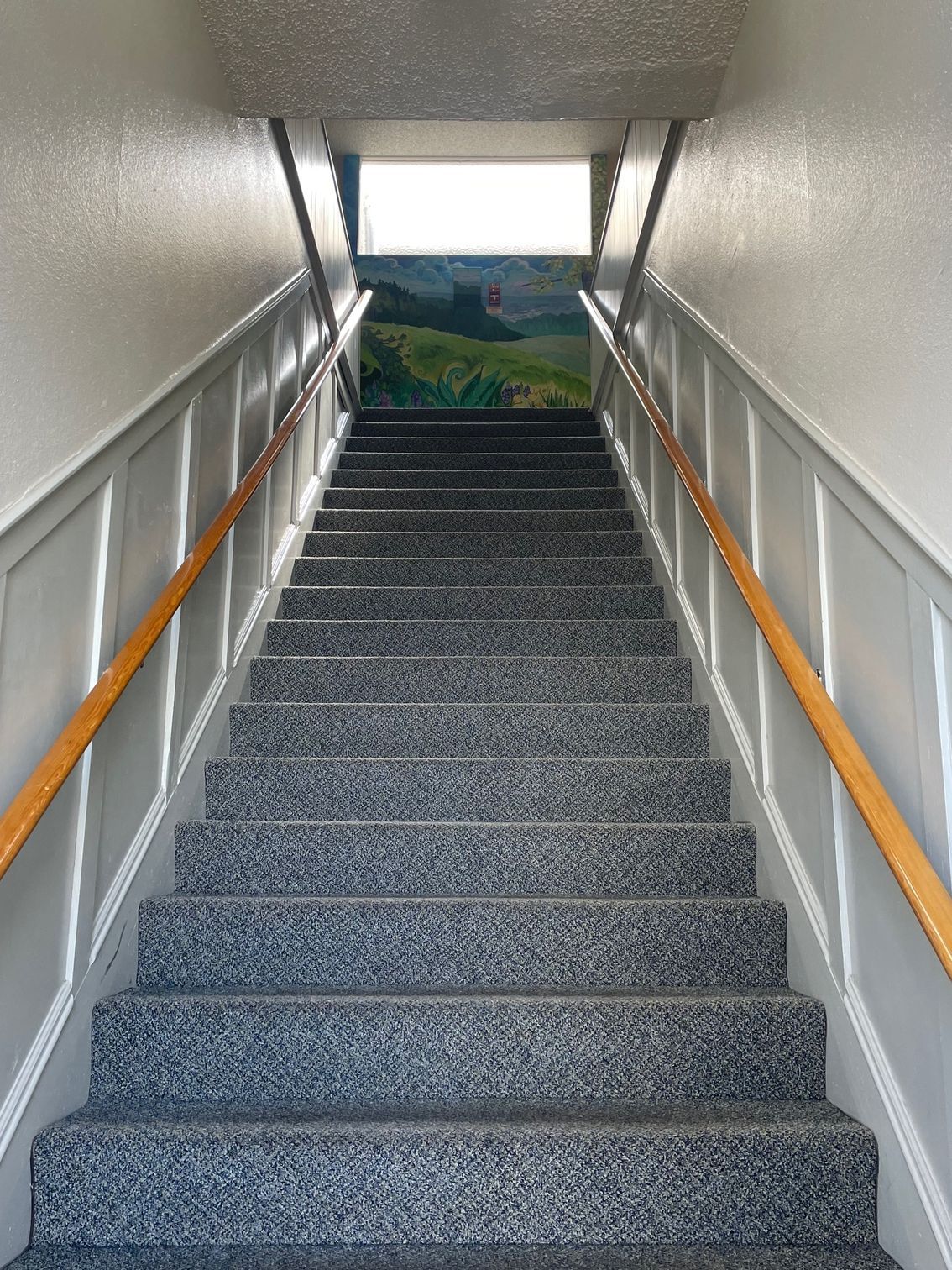 A set of stairs leading up to a window