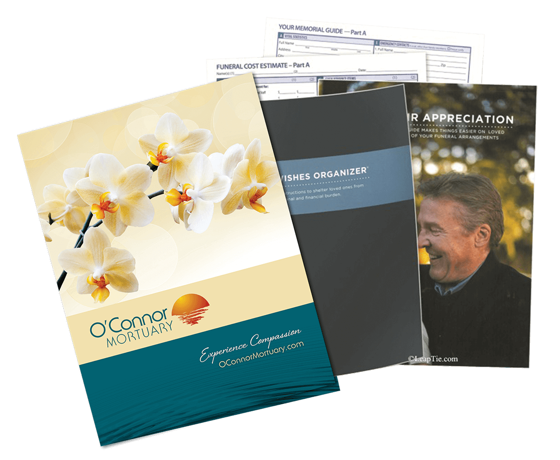 Brochures and documents, including a floral-themed cover, stacked on a white surface.