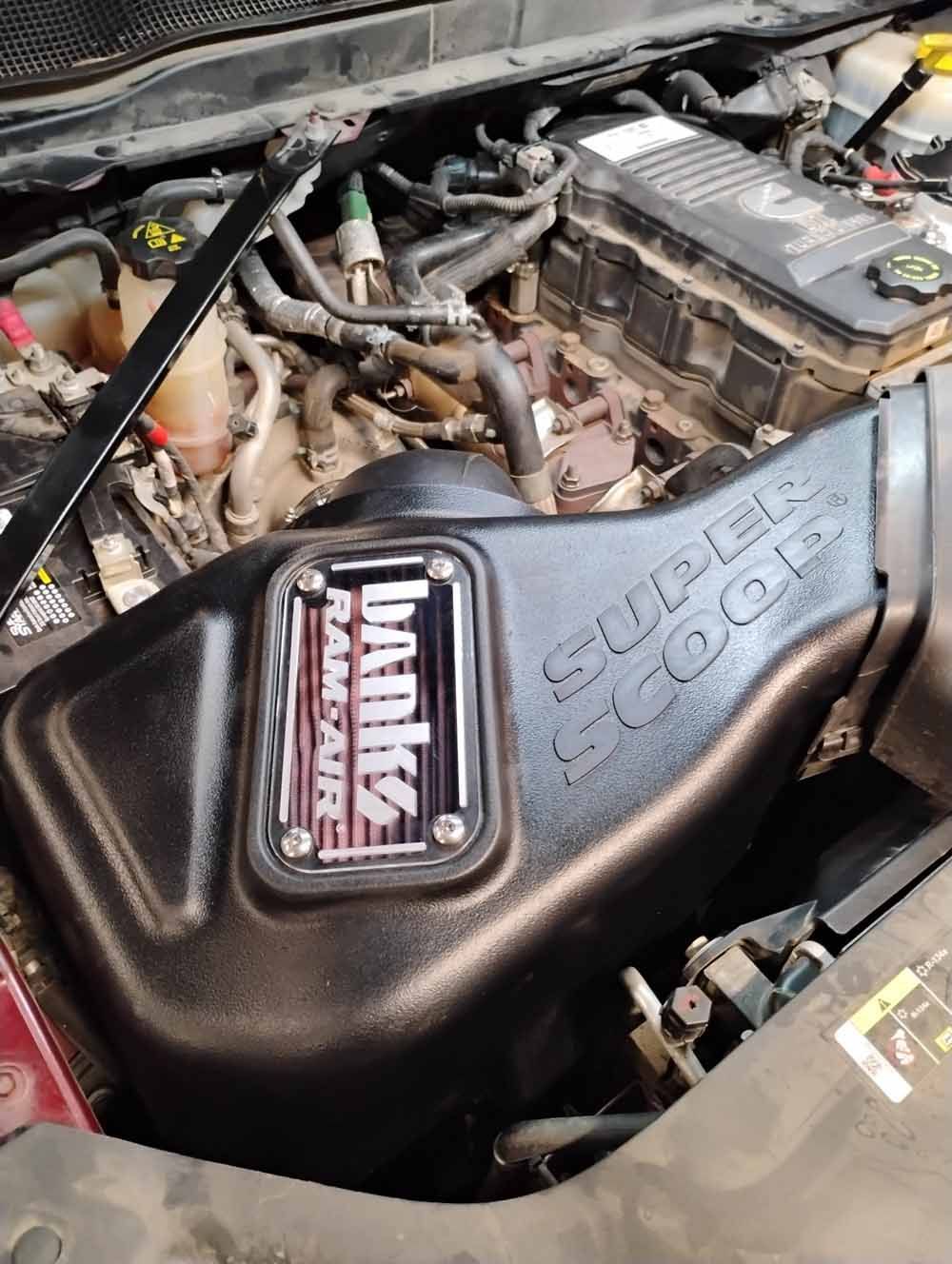 Black Banks Ram-Air Super Scoop air intake installed in a vehicle's engine bay.