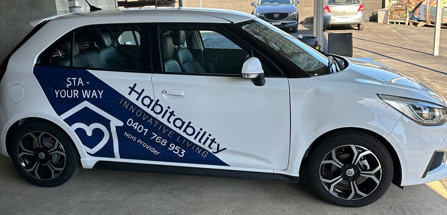 A White Truck is Parked in a Parking Lot — Print Spot Group in South Murwillumbah, NSW