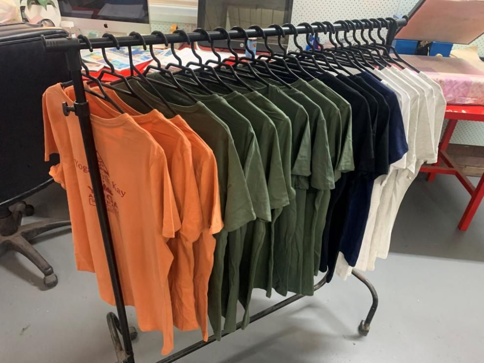 Row Of T-Shirts Are Hanging On A Rack — Print Spot Group in South Murwillumbah, NSW