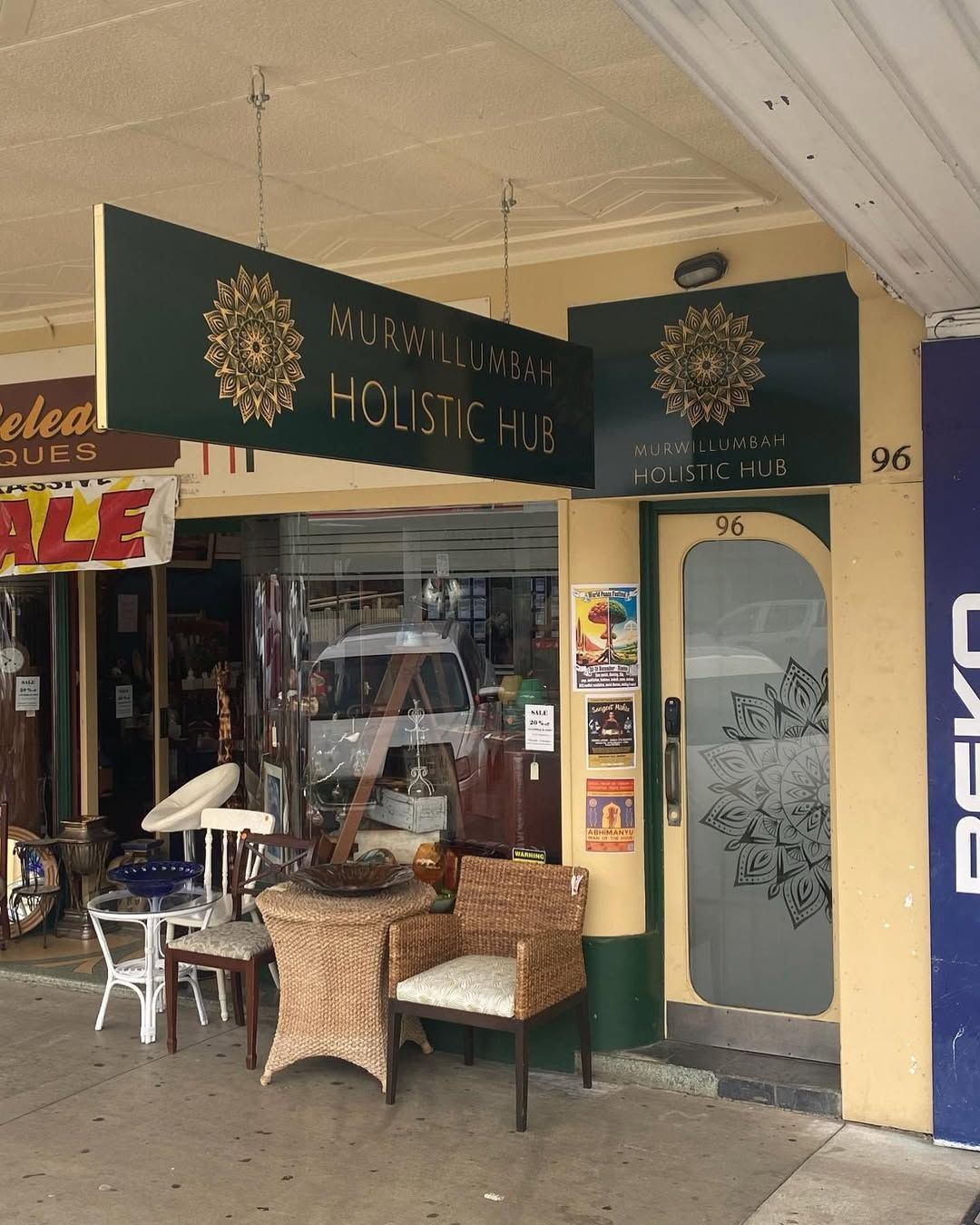 A Store Front With a Sign That Says Holistic Hub on It — Print Spot Group in Kingscliff, NSW