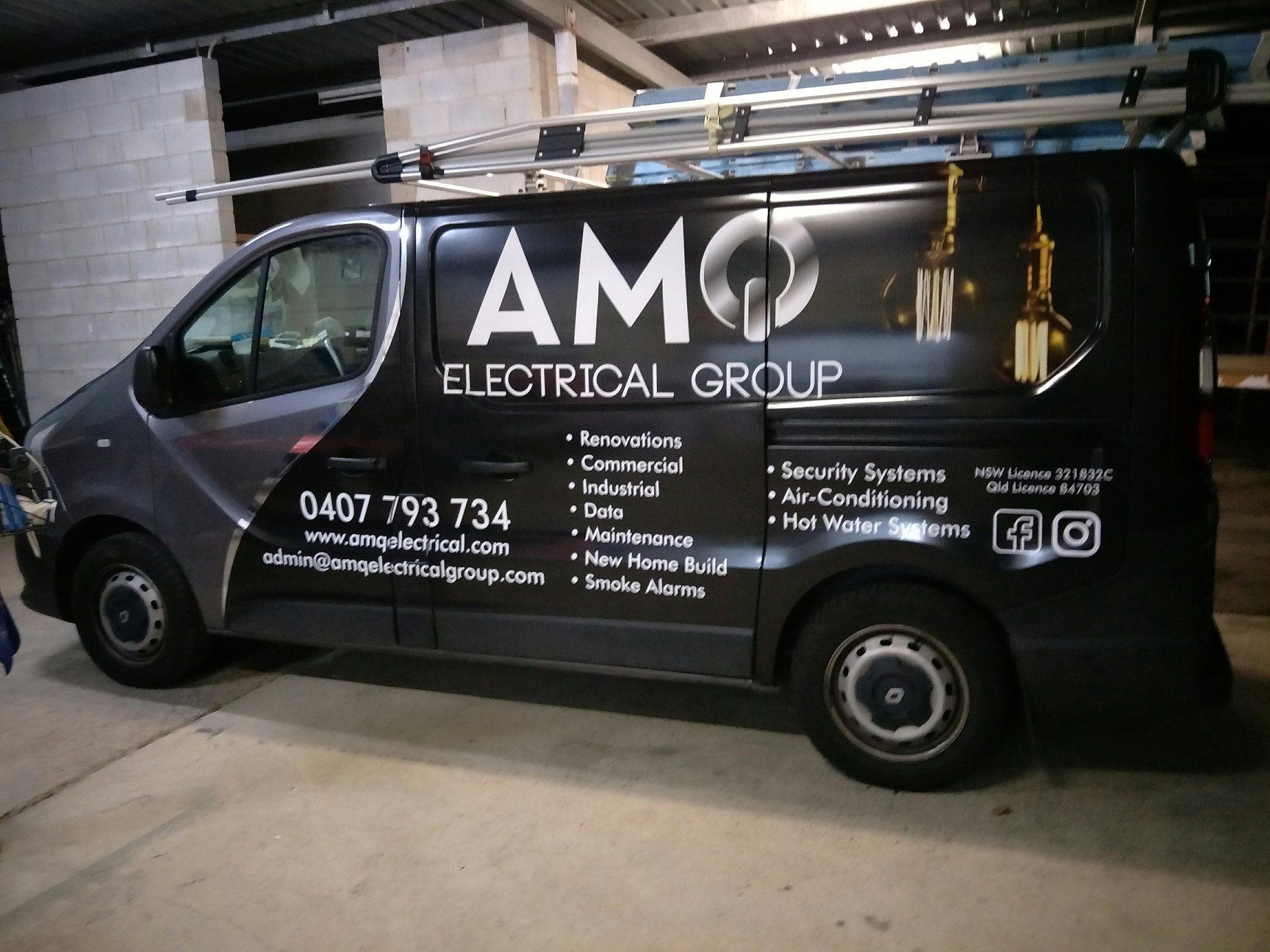 A Van is Parked in a Grassy Field — Print Spot Group in South Murwillumbah, NSW