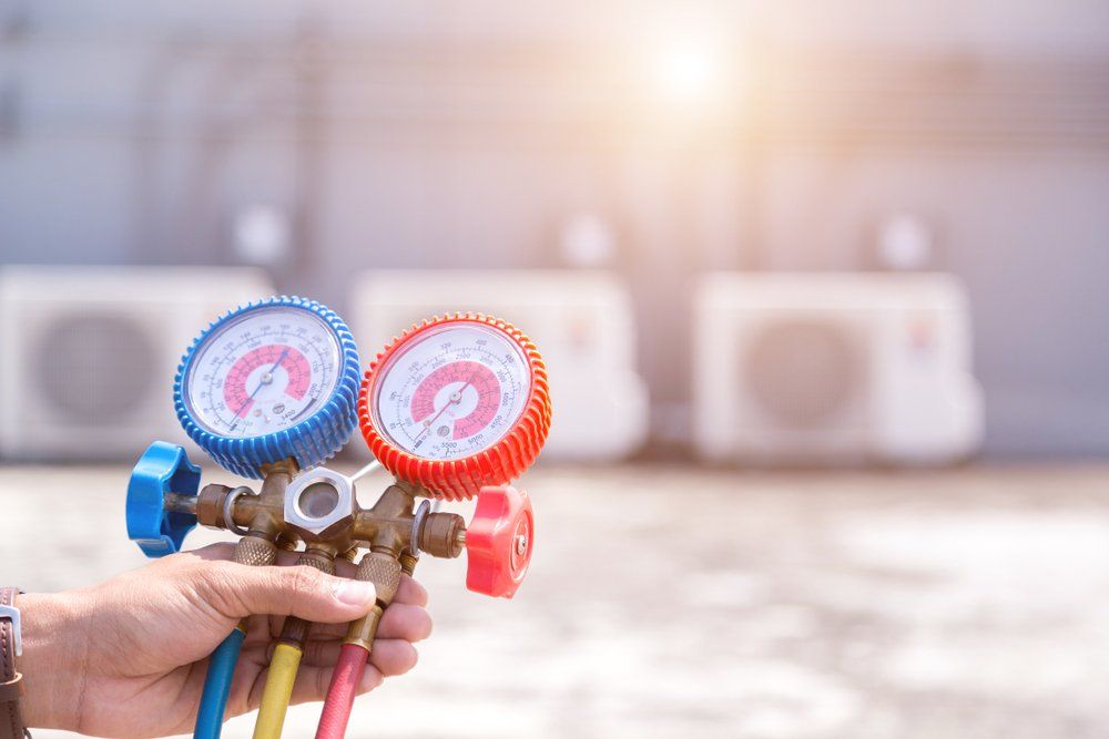 man performing commercial hvac services & repair in Wheaton, IL