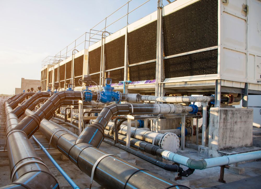 A set of cooling towers installed on a roof highlighting the different types of chillers