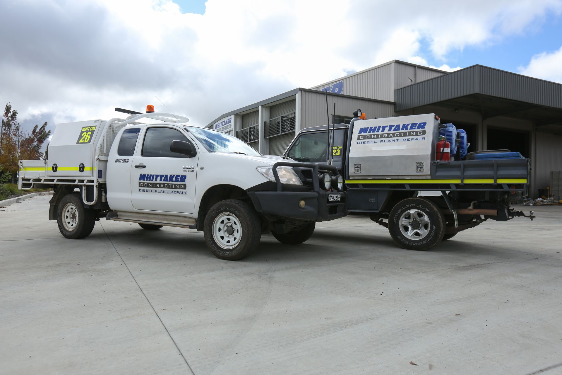 A Man Wearing a Hard Hat and Safety Glasses Is Working on a Machine | Orange, NSW | Whittaker Contracting