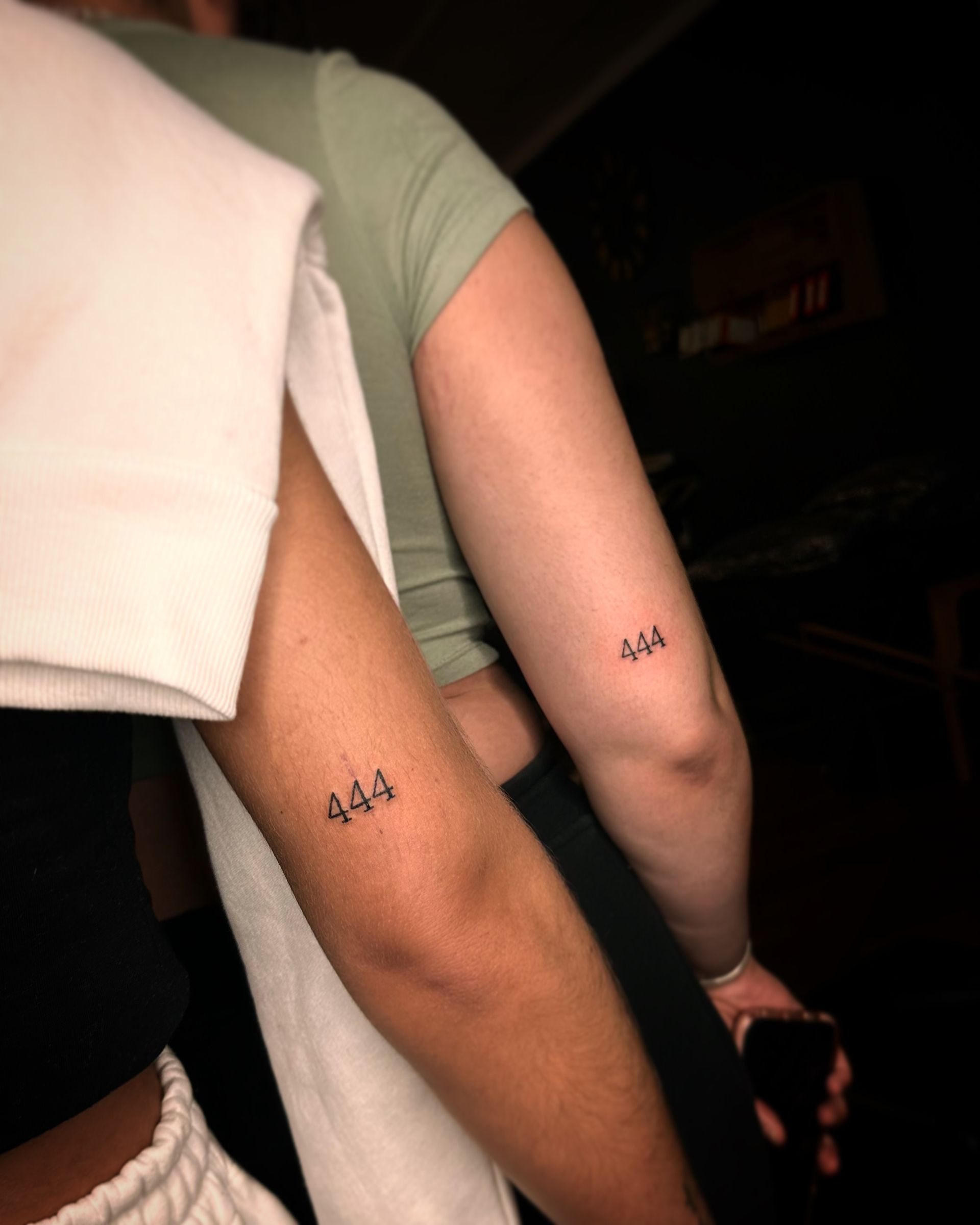 Two people standing side-by-side, each with a matching 