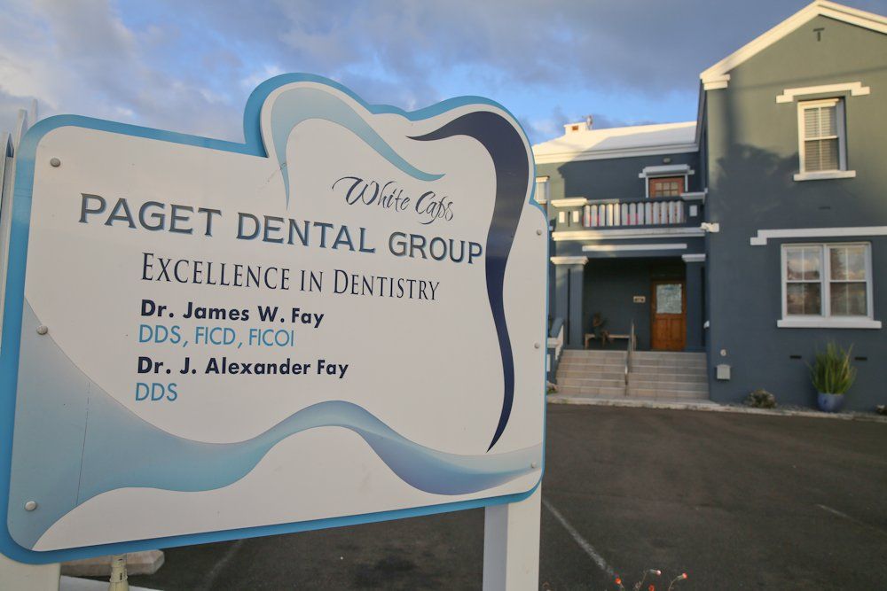 Paget Dental Group's office sign outside as seen from the road