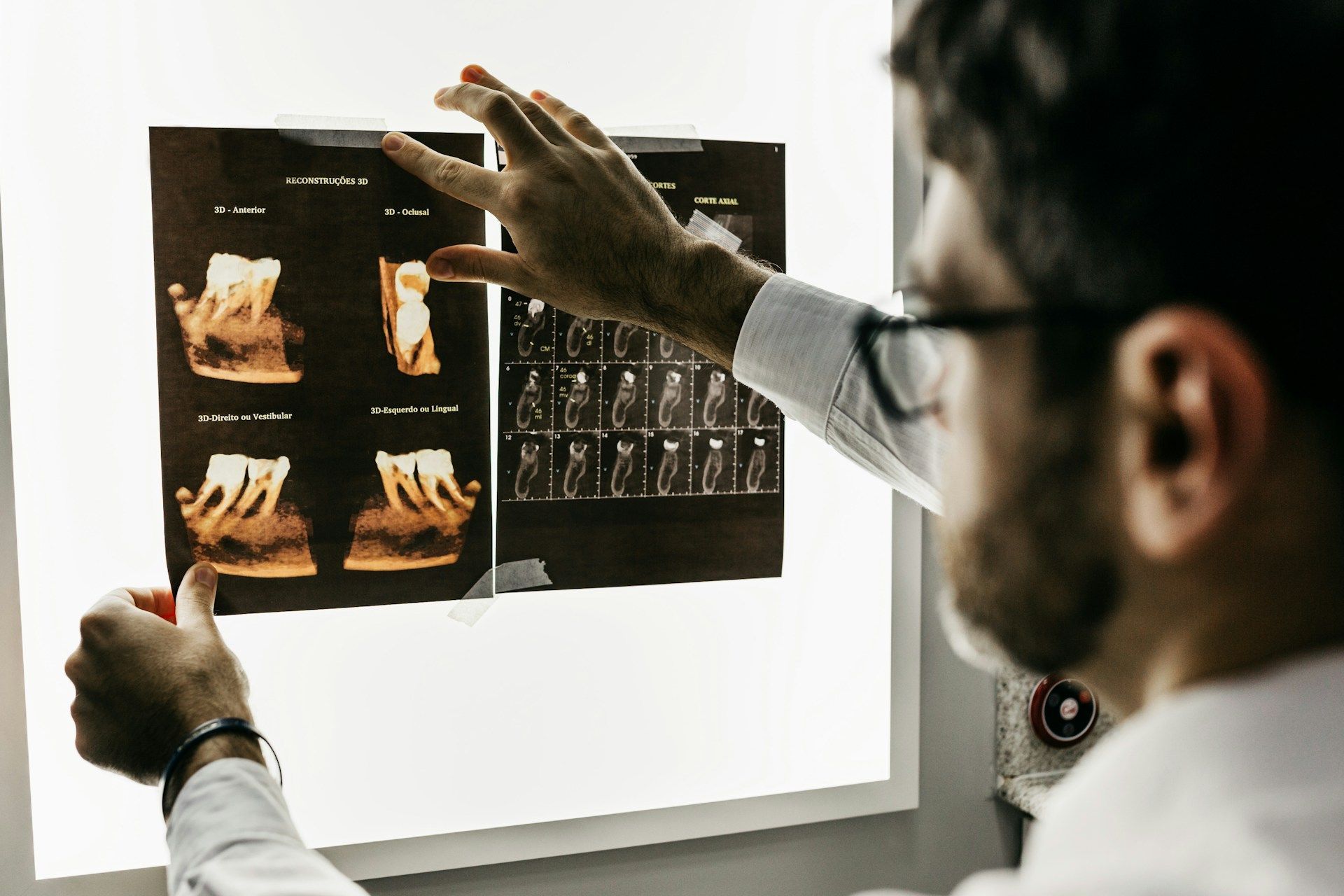 dentist looking at tooth xray