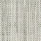 Close-up of a light-colored woven fabric with a textured surface.
