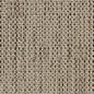 Close-up of a woven, beige textile with a grid-like pattern of square openings.