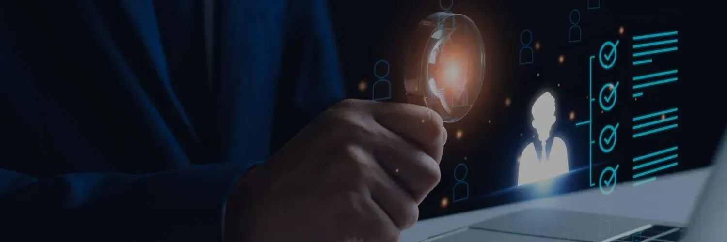 Hand holding glowing digital orb above a laptop with cyber security icons on dark blue screen
