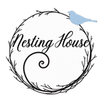 Logo with black twig wreath and script text &ldquo;Nesting House,&rdquo; topped by a small blue bird