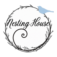 Logo with black twig wreath and script text &ldquo;Nesting House,&rdquo; topped by a small blue bird