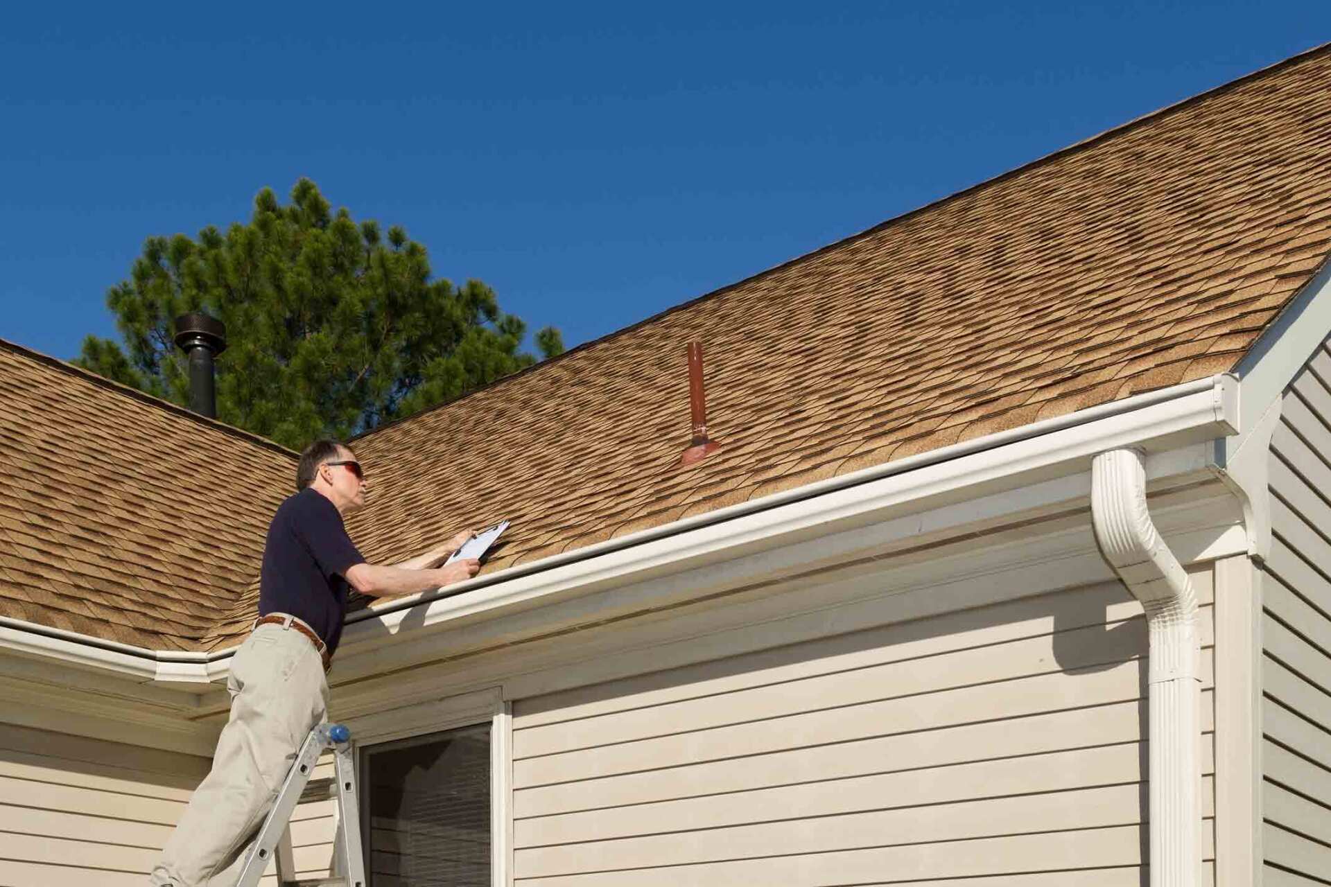 Examining A Residential Roof — Greenville, SC — Joe Roberson & Son Roofing