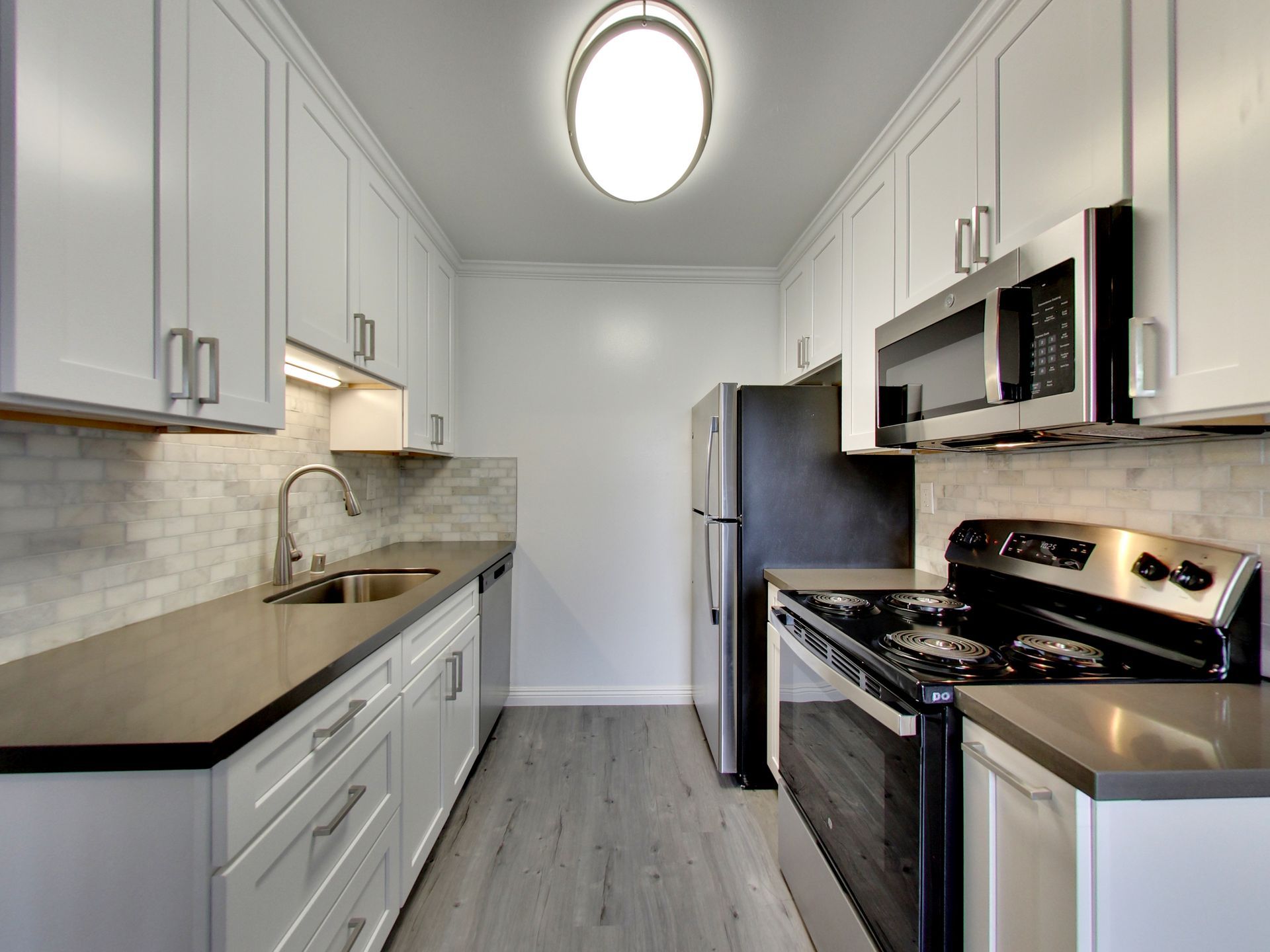 Photo of updated kitchen with stainless steel appliances