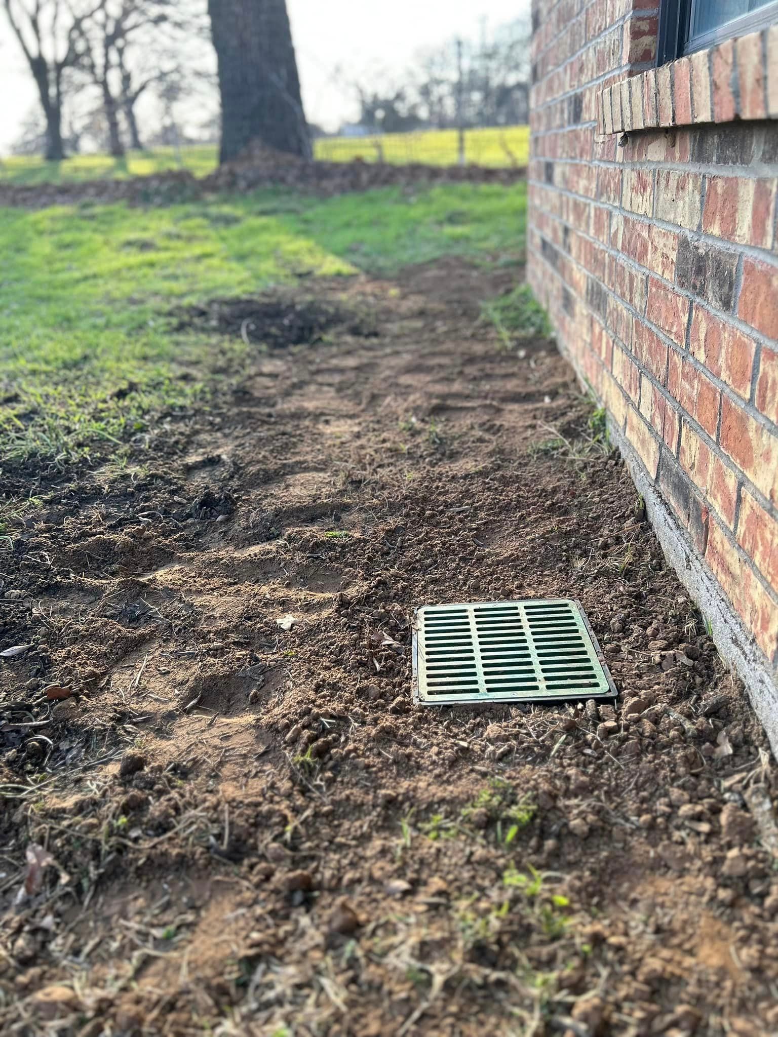 A Green Drain Is Sitting in The Dirt - Collinsville, TX - L5 Irrigation