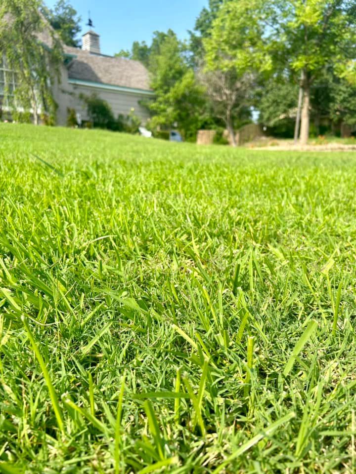 A Wooden Fence Surrounds a Lush Green Yard - Collinsville, TX - L5 Irrigation