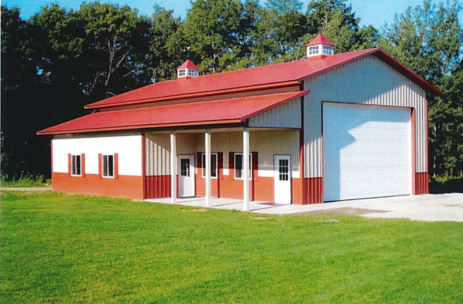 A red and white building with a white garage door
