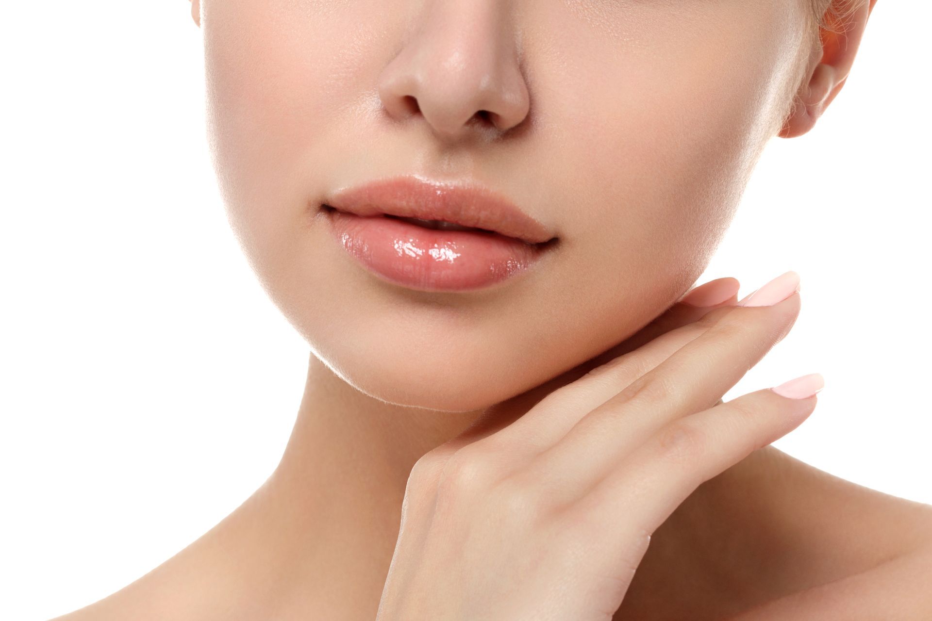 Close-up of a person's face and hand. The person has smooth skin, glossy lips, and is gently touching their neck.