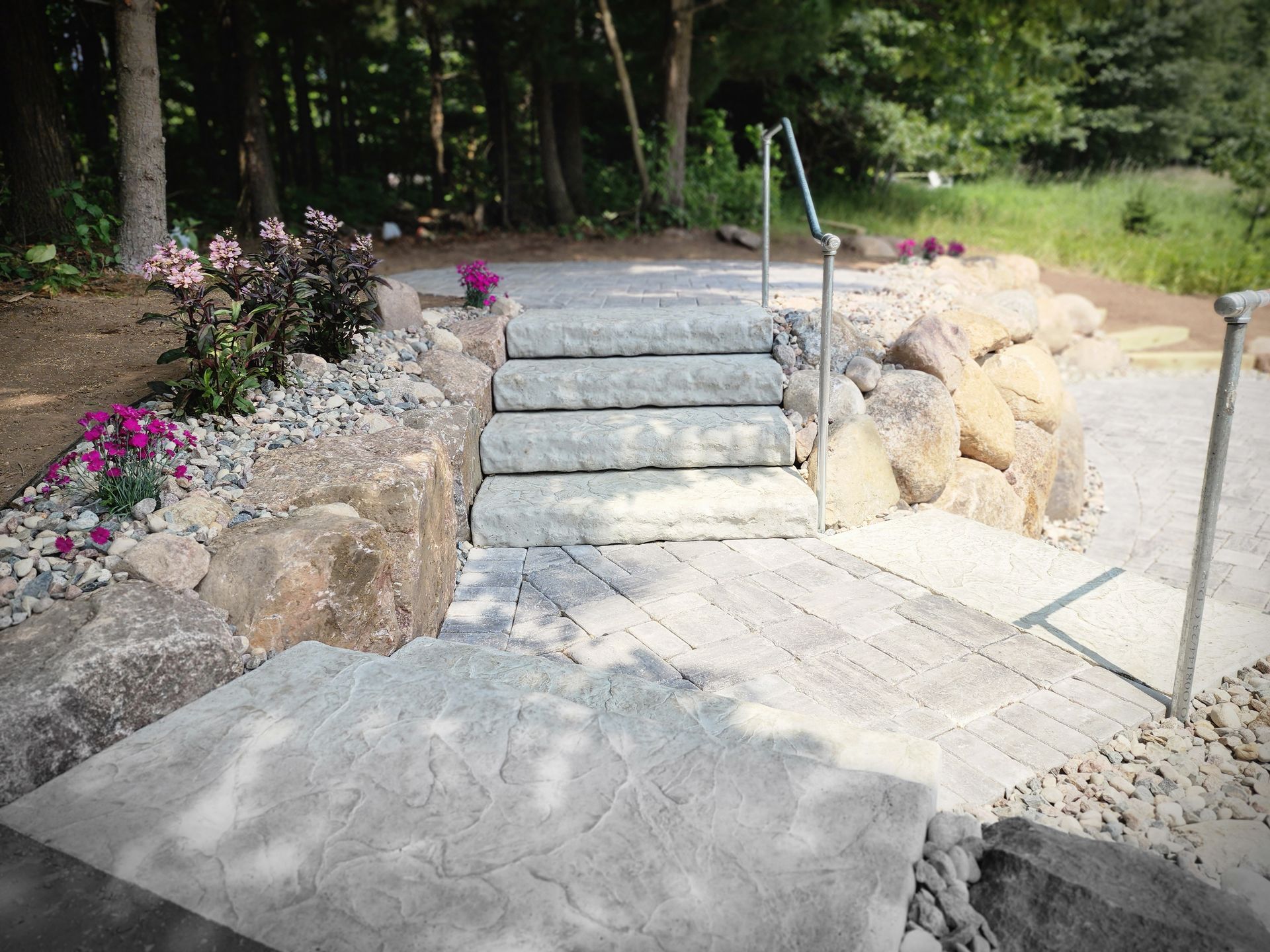 new rock stairs and patio with railing in Mosinee, Wisconsin
