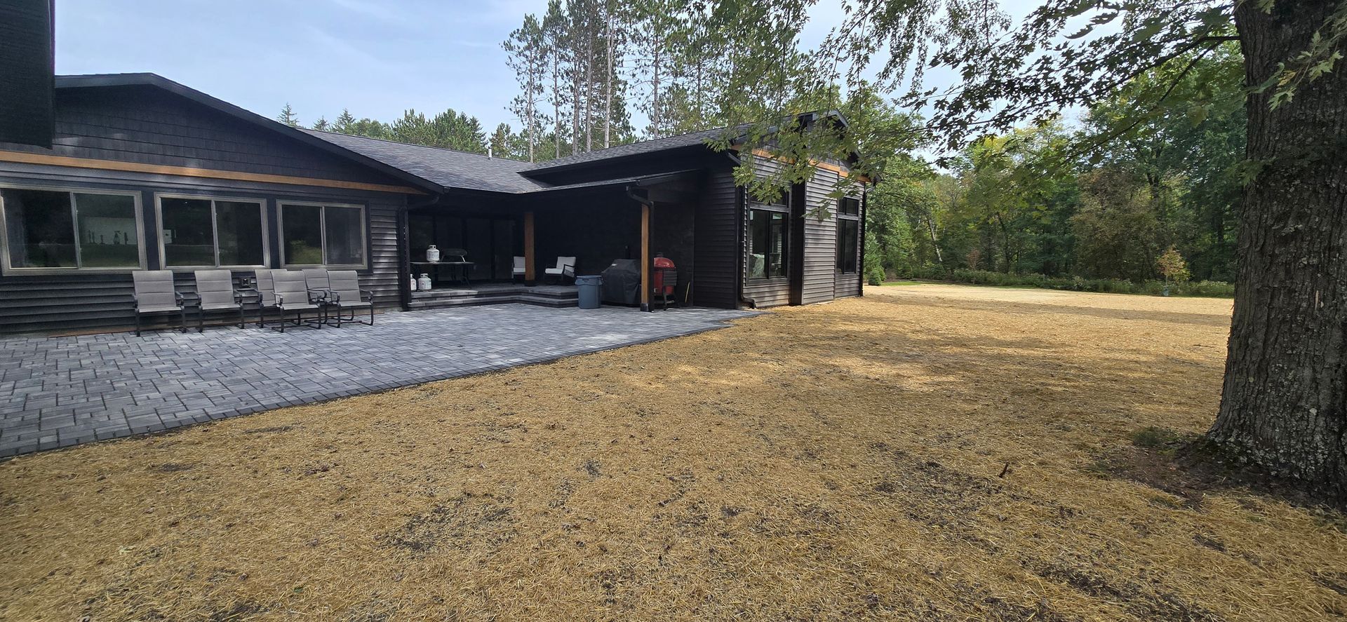 A large house with a large lawn in front of it.