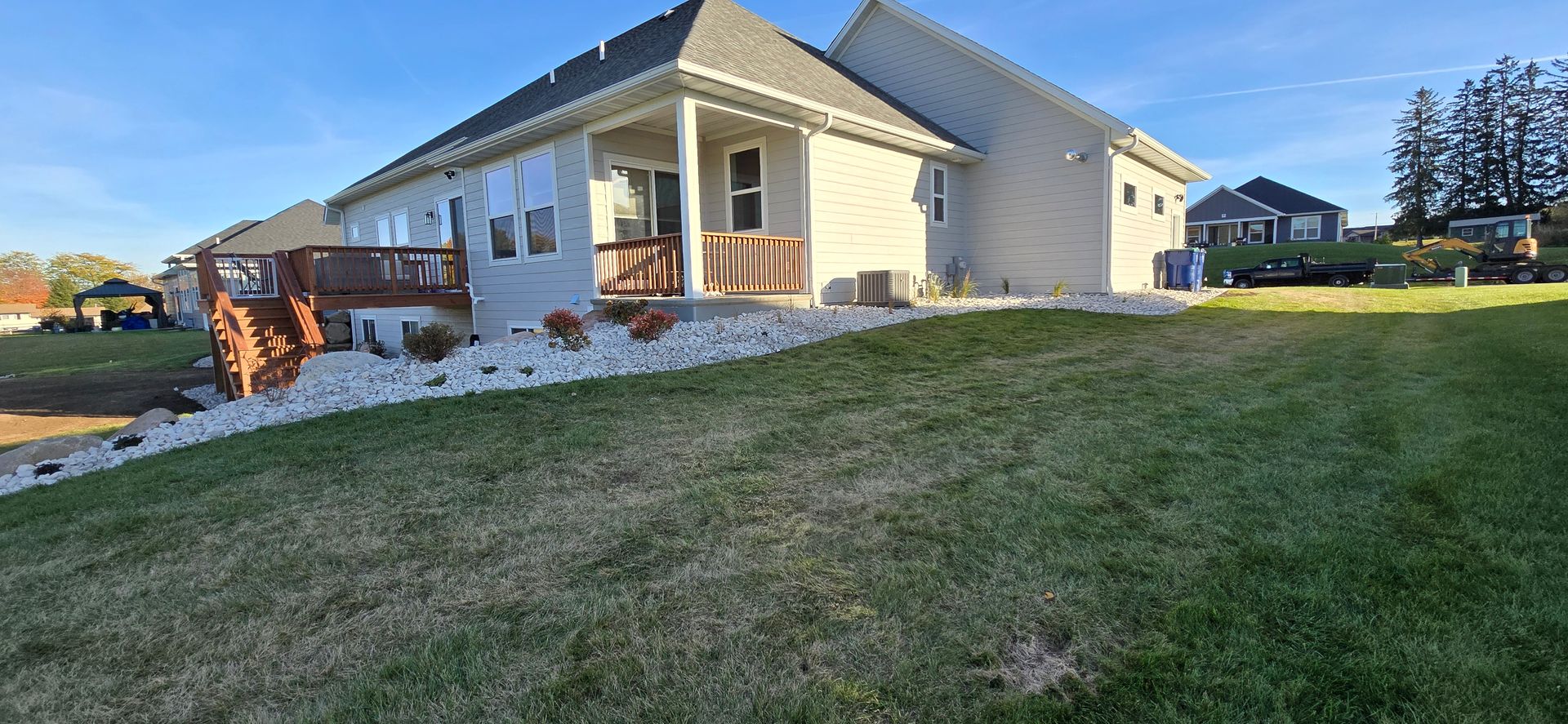 A large house with a large lawn in front of it.