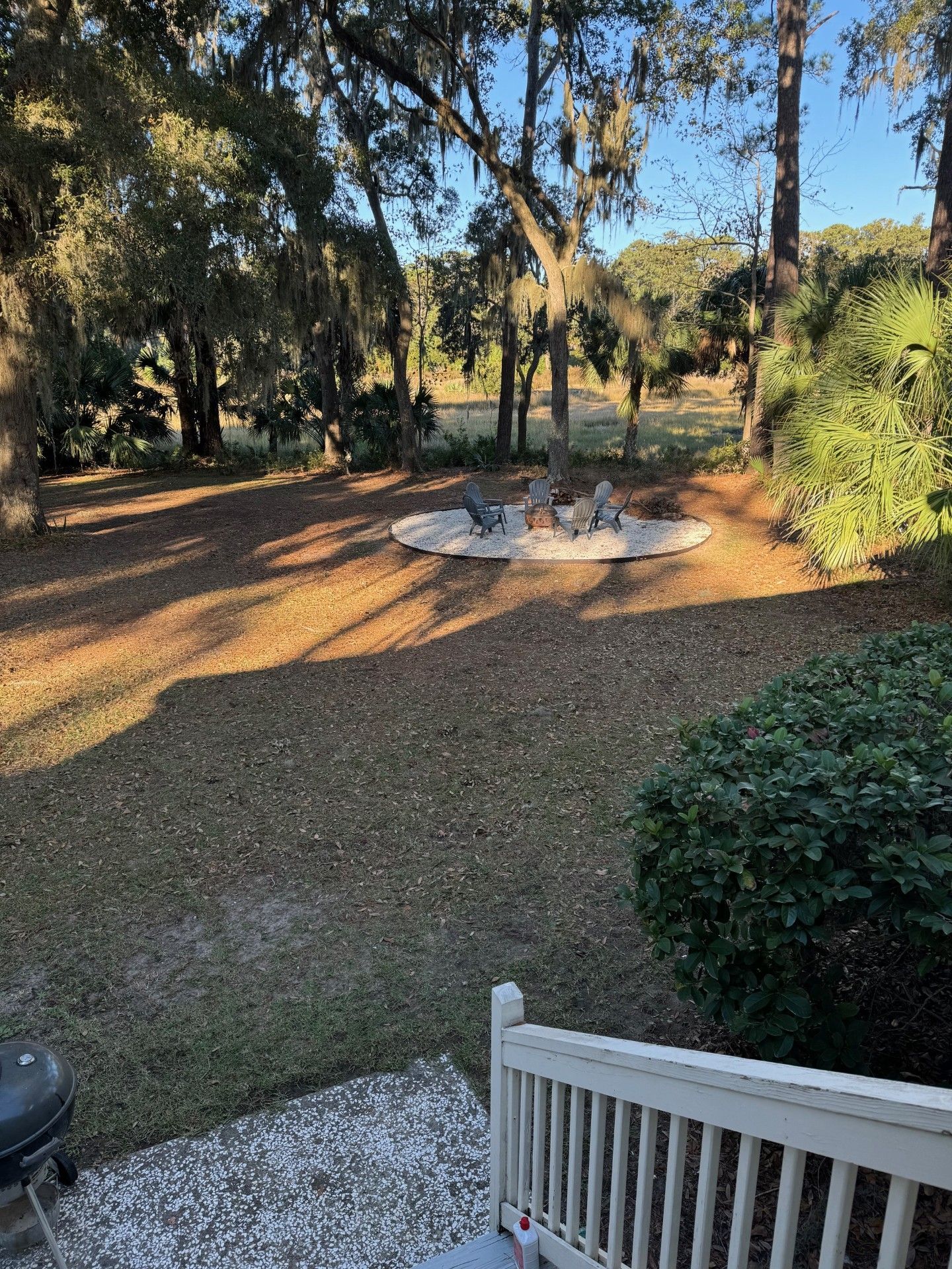 There is a picnic table in the middle of the yard.