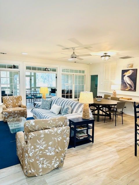 A living room with a couch and chairs and a table