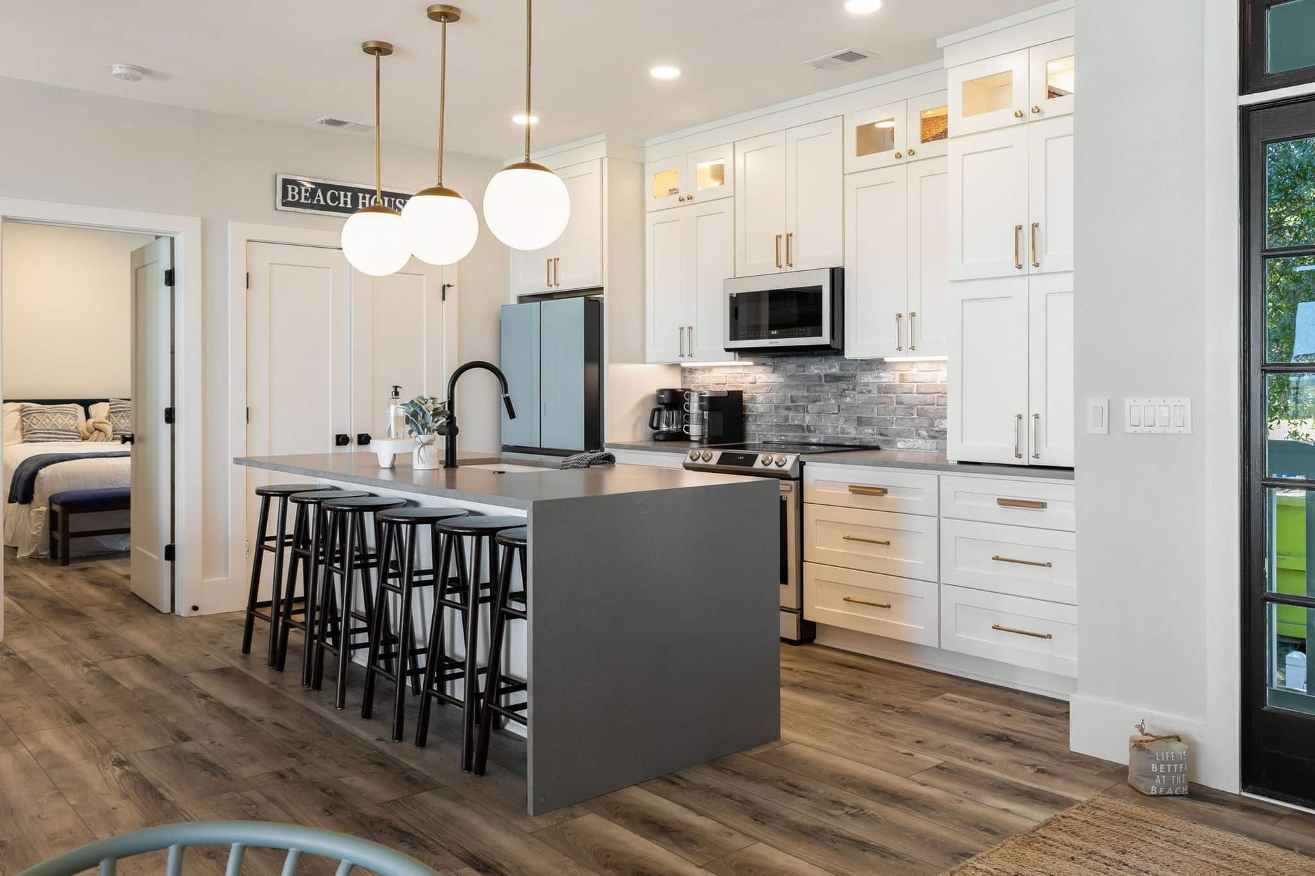There is a large island in the middle of the kitchen.