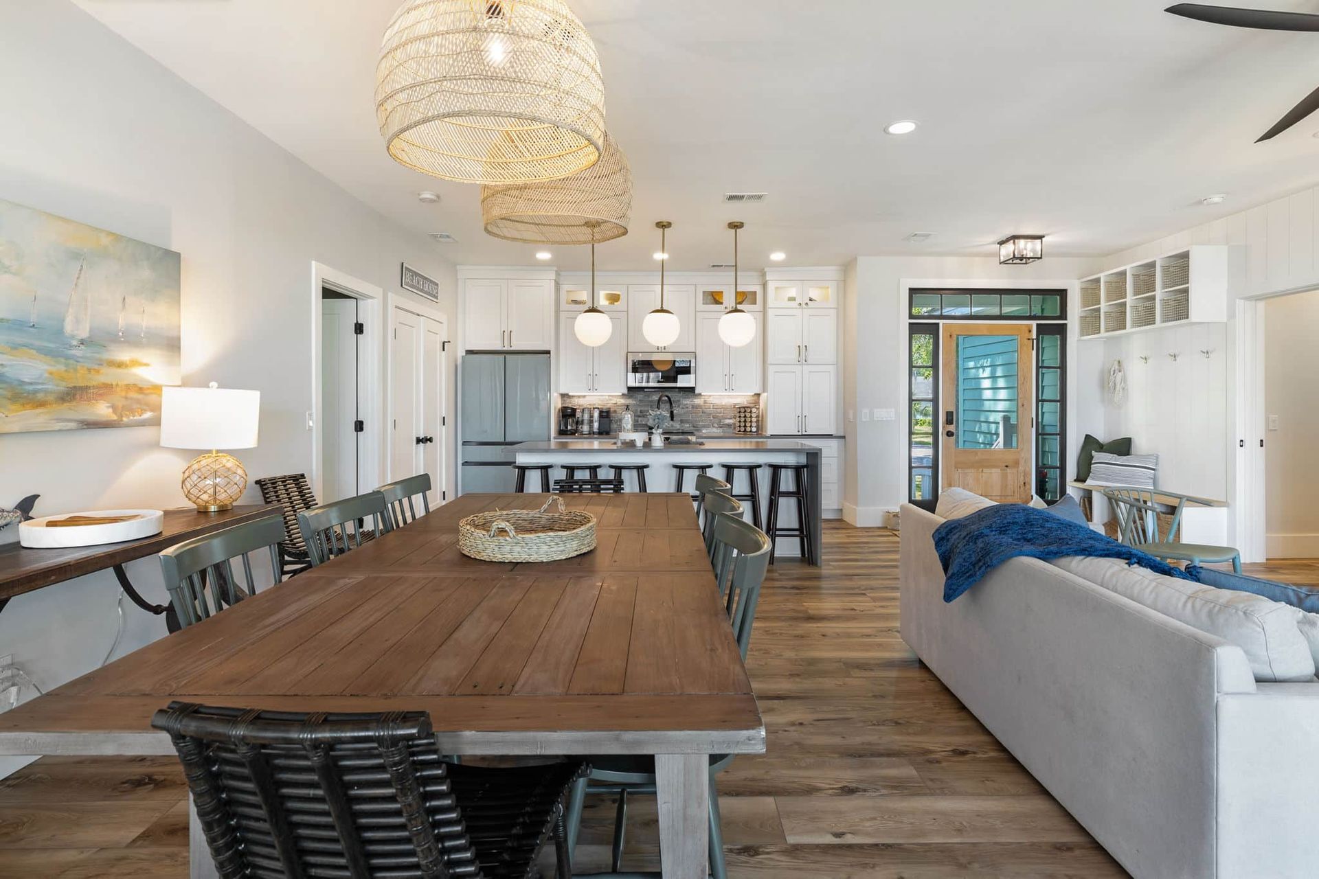 There is a large wooden table in the middle of the room.
