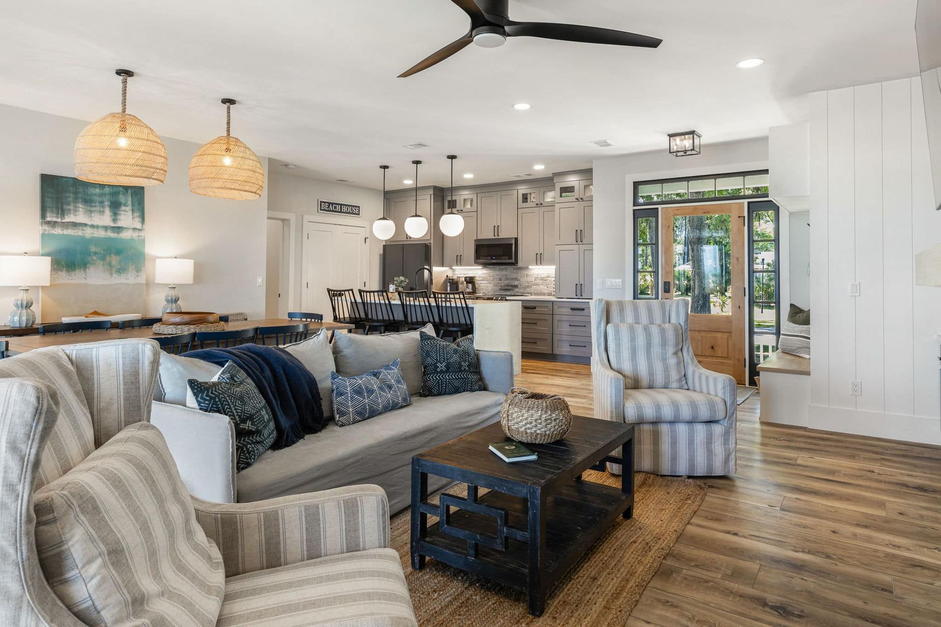 A living room filled with furniture and a ceiling fan.