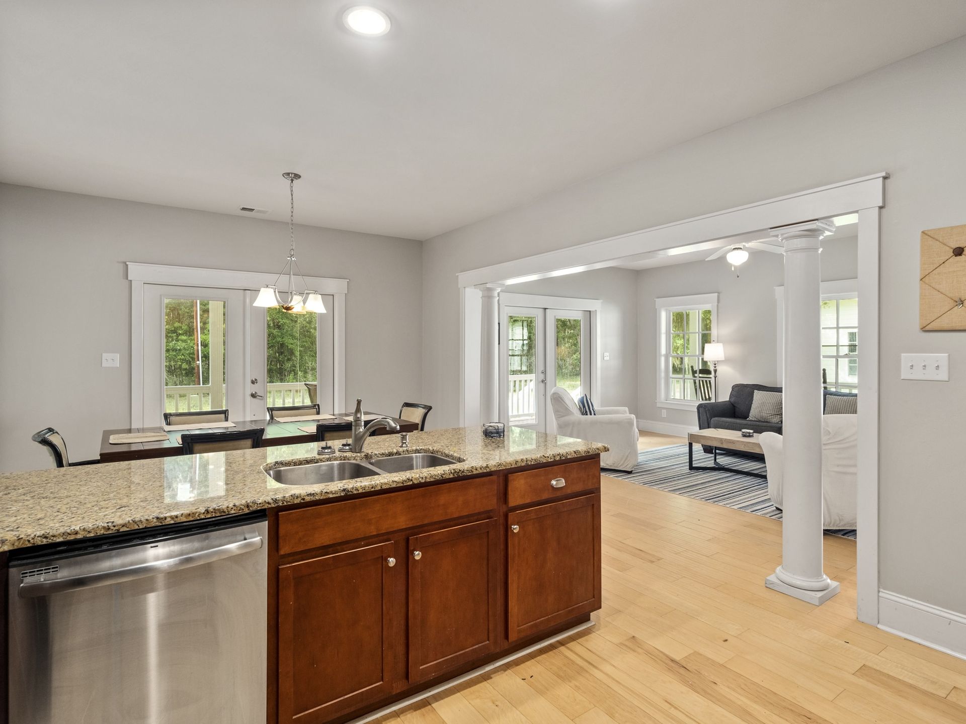 A kitchen with stainless steel appliances and granite counter tops.