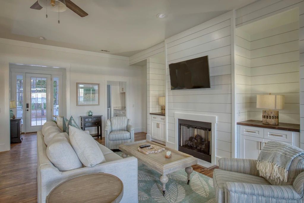 A living room filled with furniture and a fireplace.