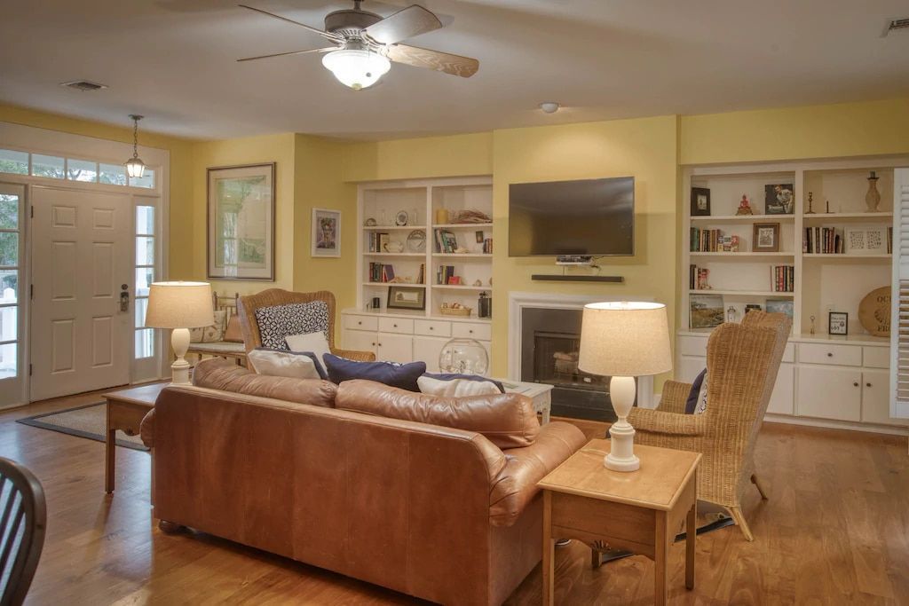 A living room filled with furniture and a flat screen tv.