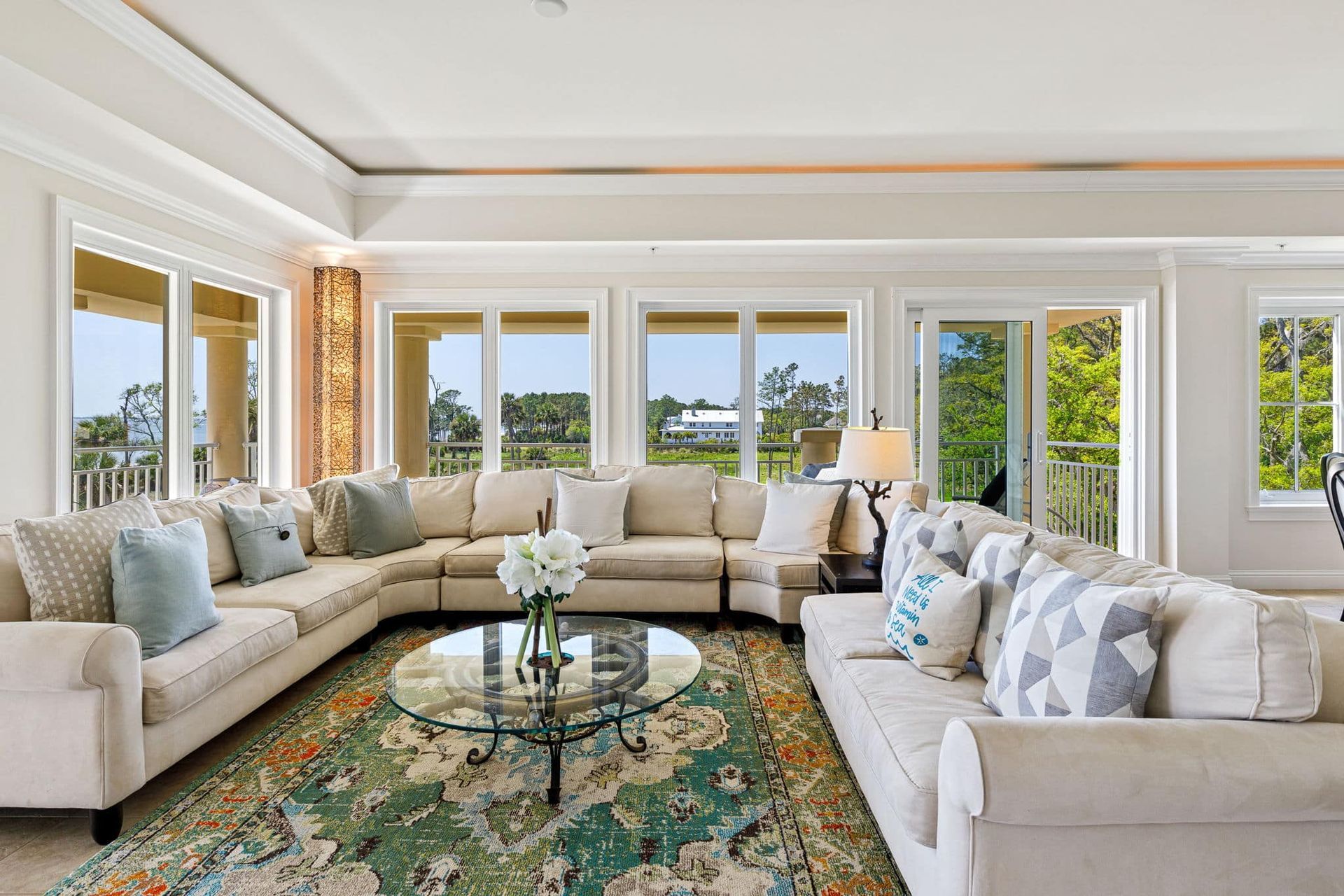 A living room filled with furniture and a rug.