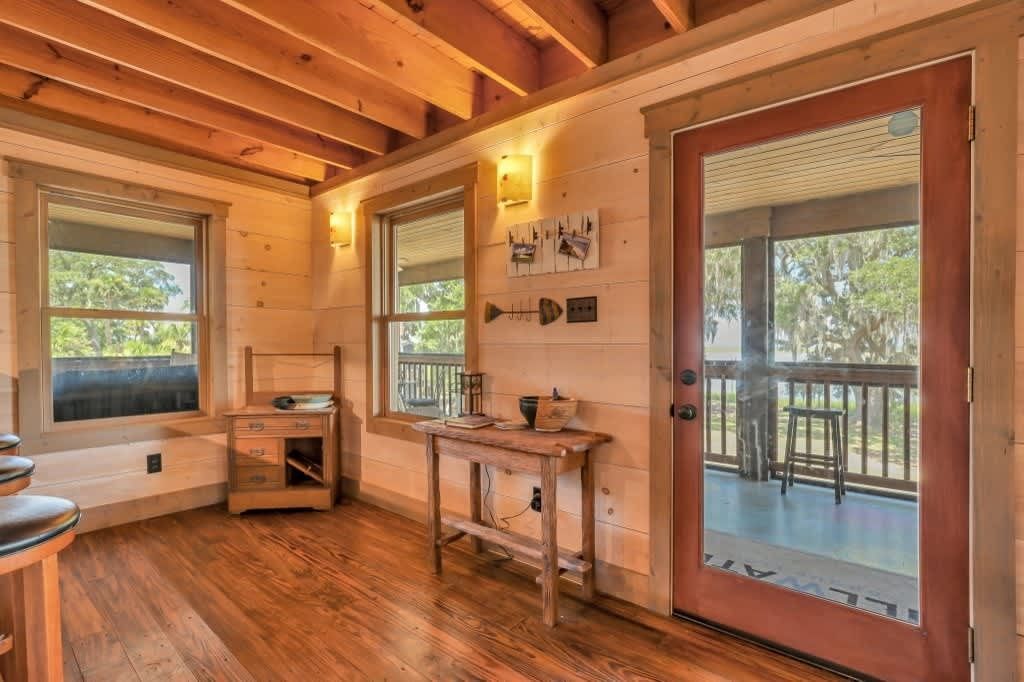 A bathroom with a toilet , sink and mirror.