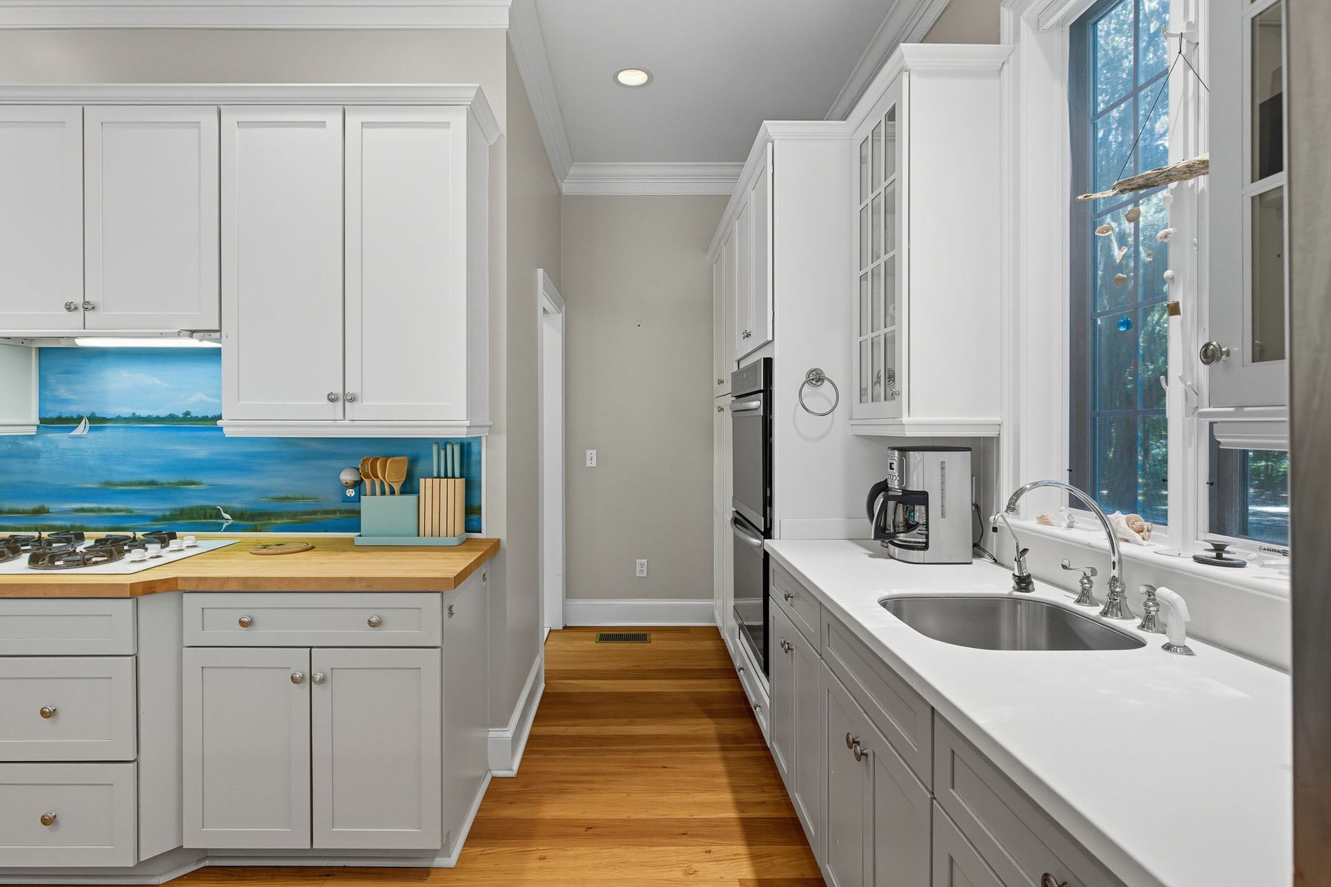 A bathroom with a walk in shower with a sliding glass door.