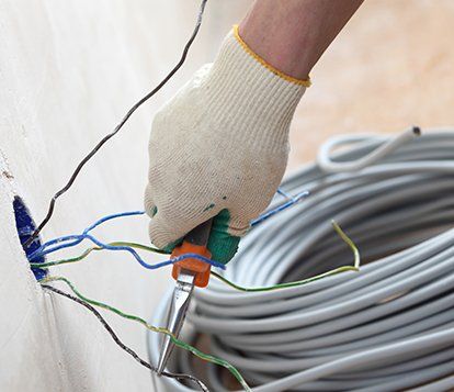 Worker Puts the Wires in the Wall — West Maryland — Brandenburg Electric Inc Worker Puts the Wires in the Wall — West Maryland — Brandenburg Electric Inc