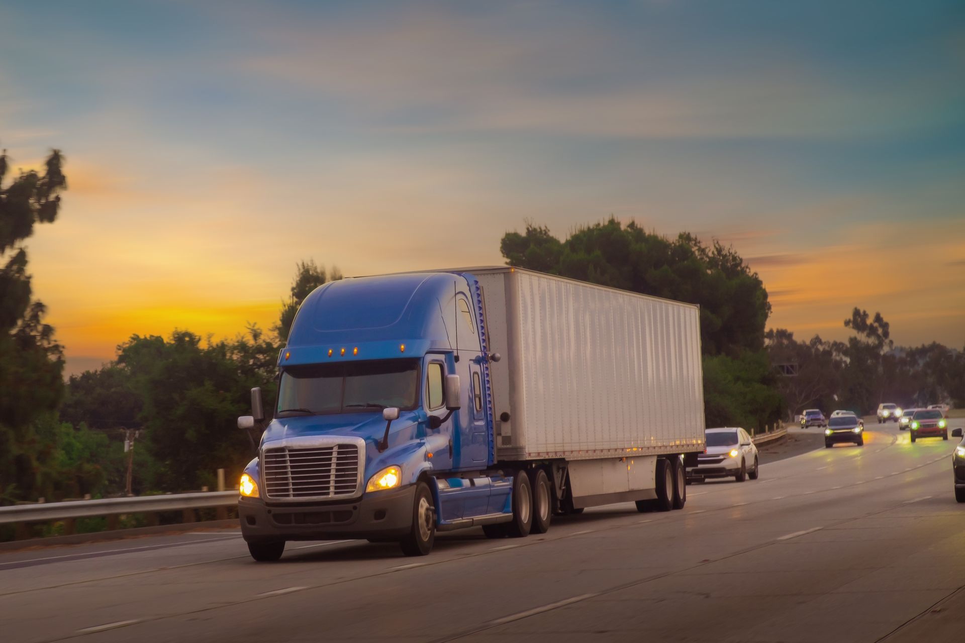 Blue semi truck driving down the highway after a mobile repair