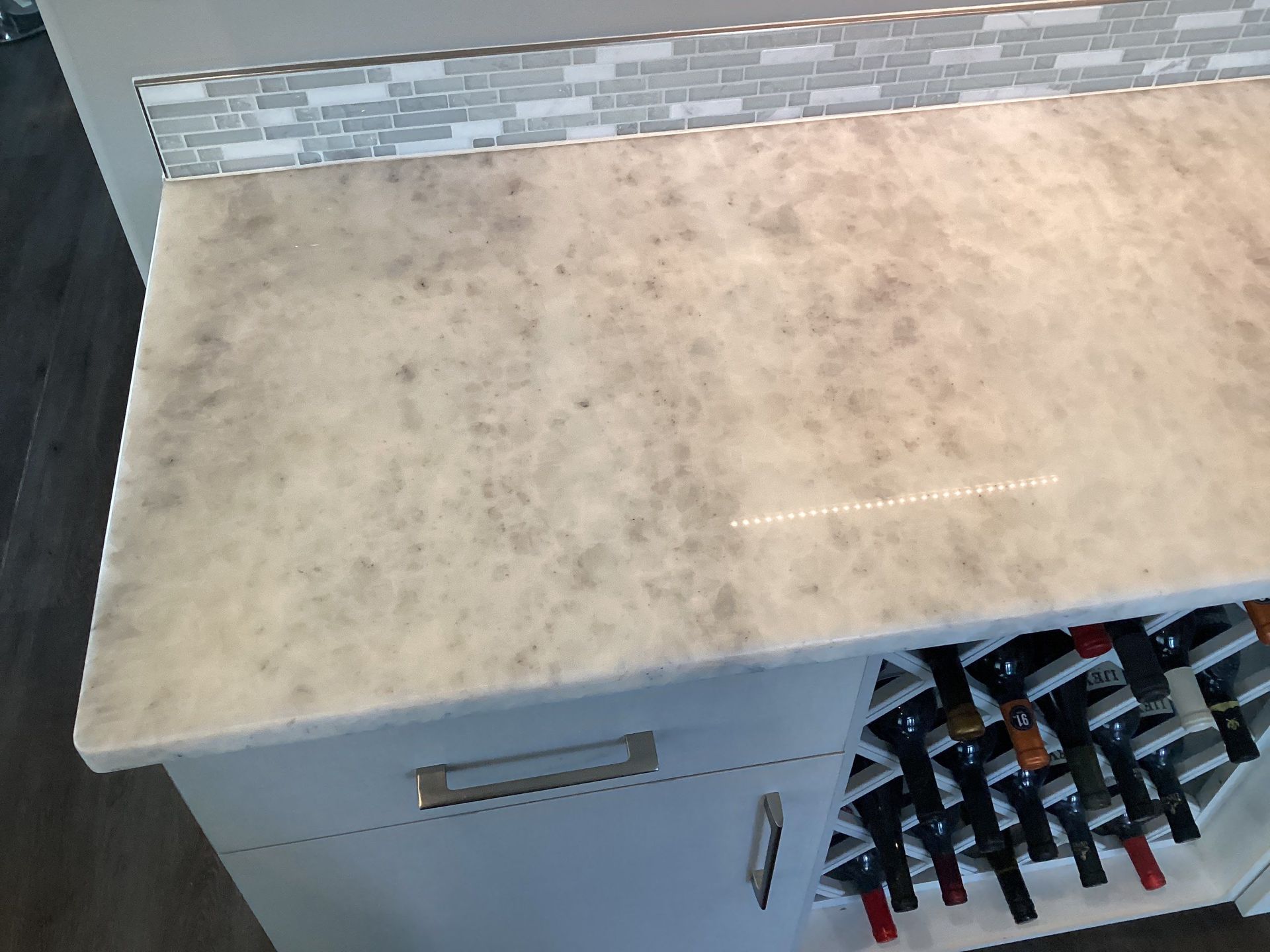 Highly polished white and gray marble countertop featuring a completed MORE® AntiEtch® treatment
