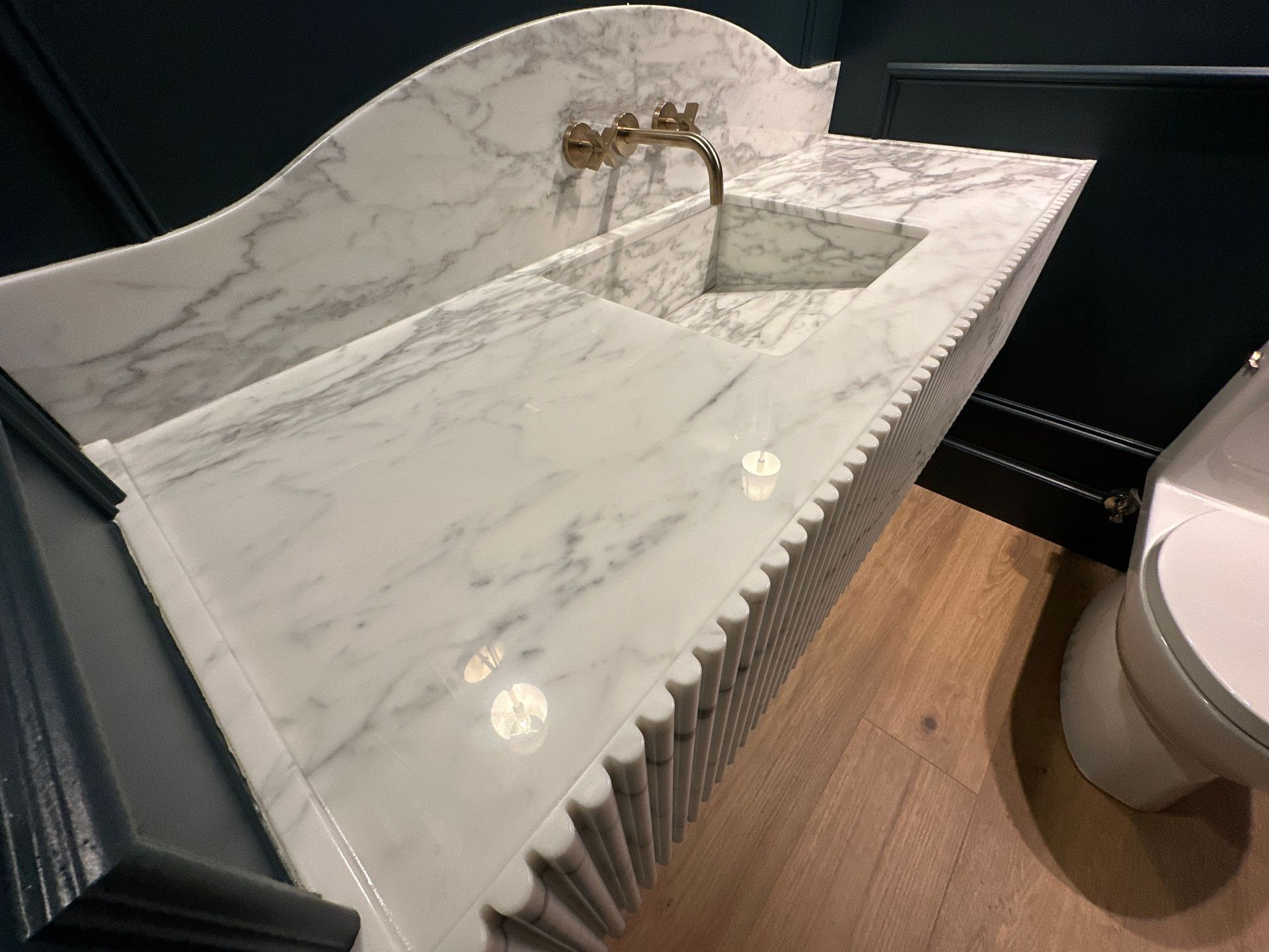 Modern bathroom featuring a white marble with gray veins and MORE AntiEtch 