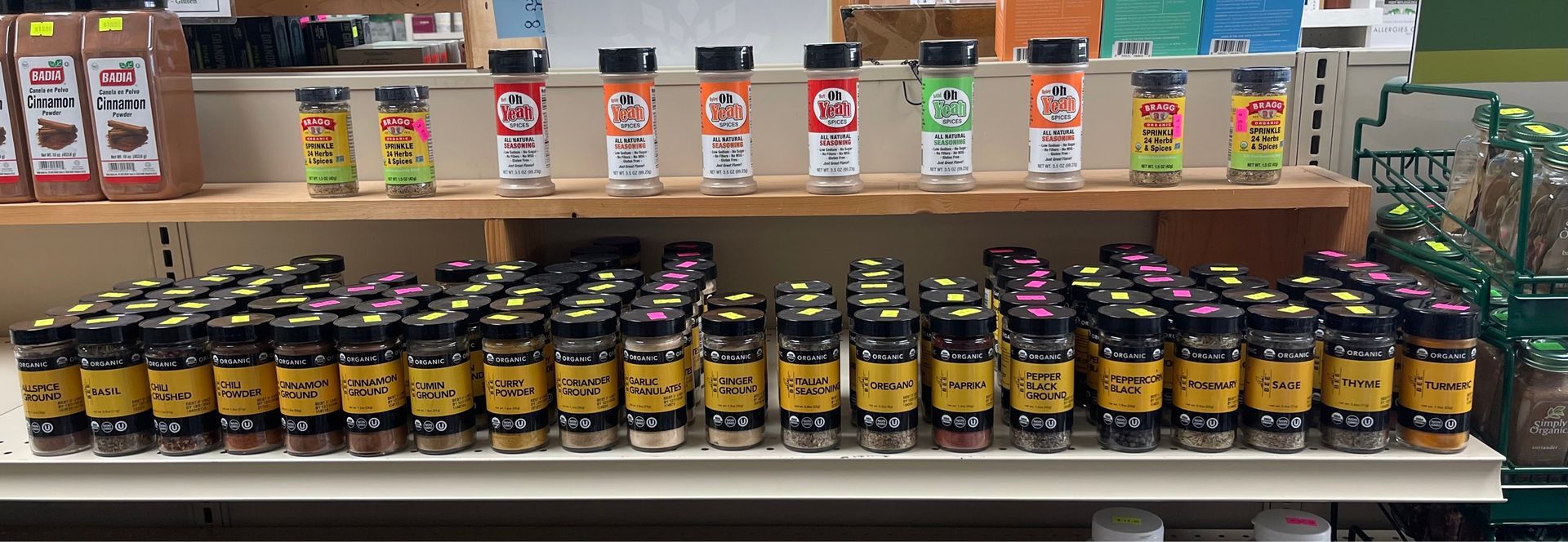 A shelf filled with jars of spices in a store. — Grand Island, NE — Natural Food Products A shelf filled with jars of spices in a store.