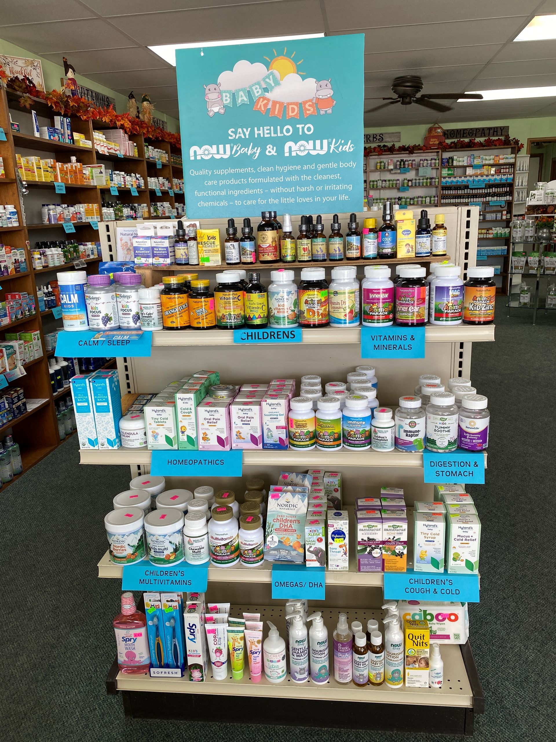A pharmacy display with a sign that says say hello to new and new