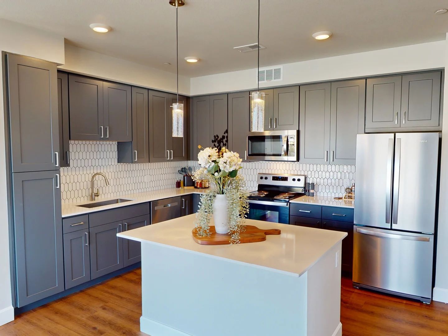 A kitchen with a large island in the middle of the room at The Experience at Epicenter