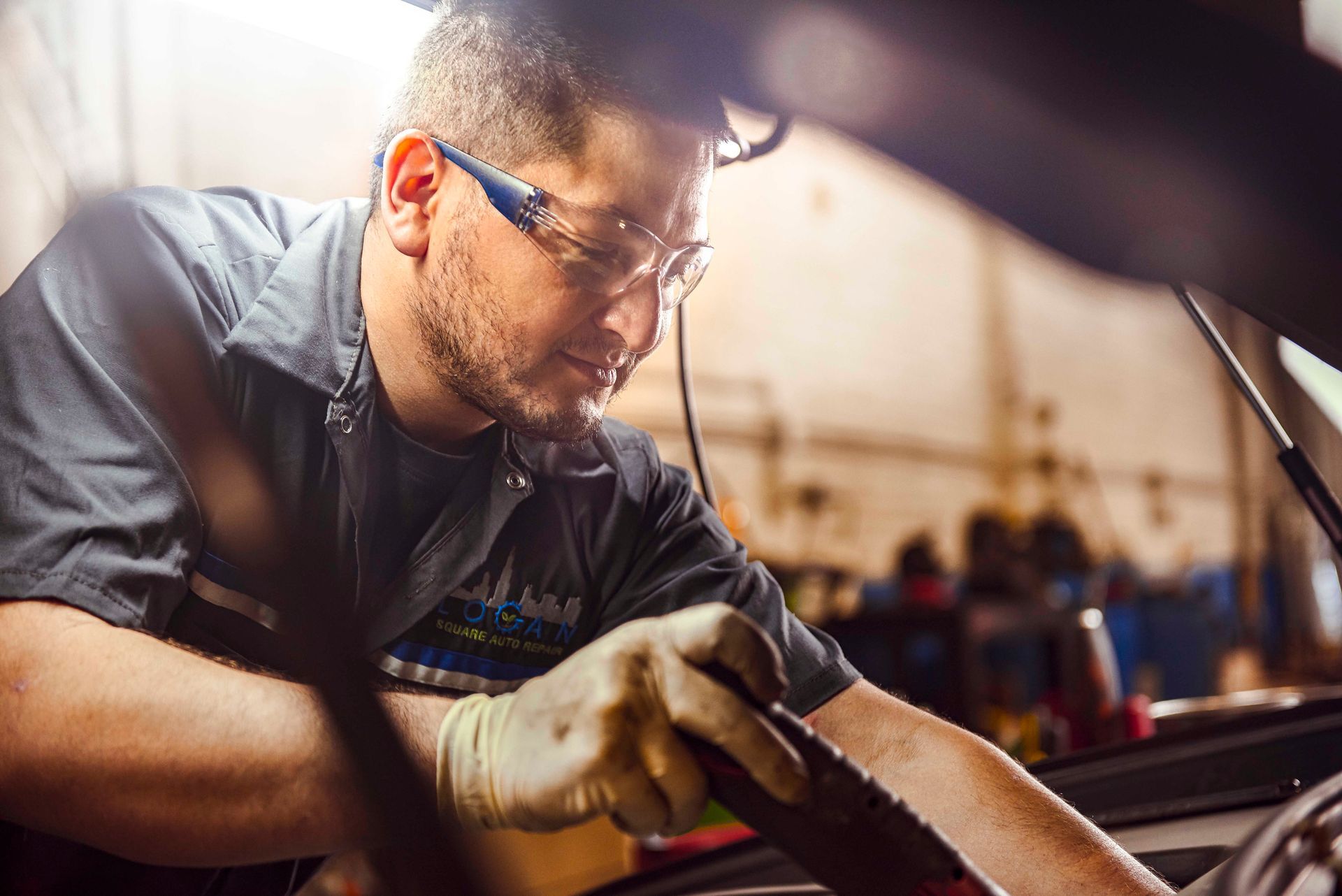 Professional mechanic working on a car engine