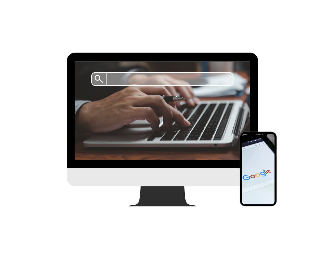 A person is typing on a laptop computer next to a cell phone.
