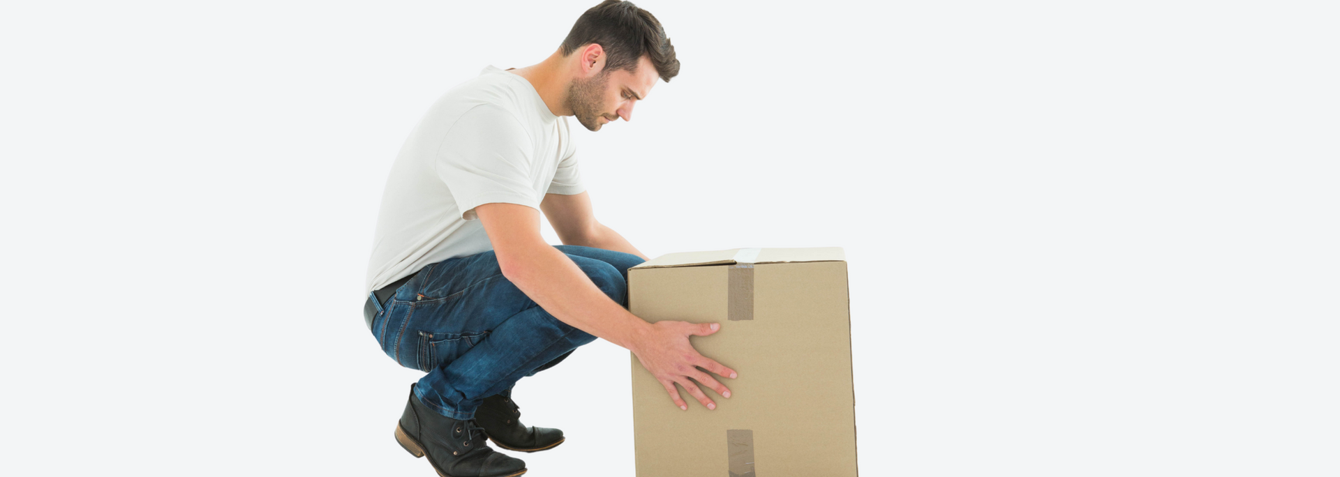 Picture of  someone getting ready to lift a box.