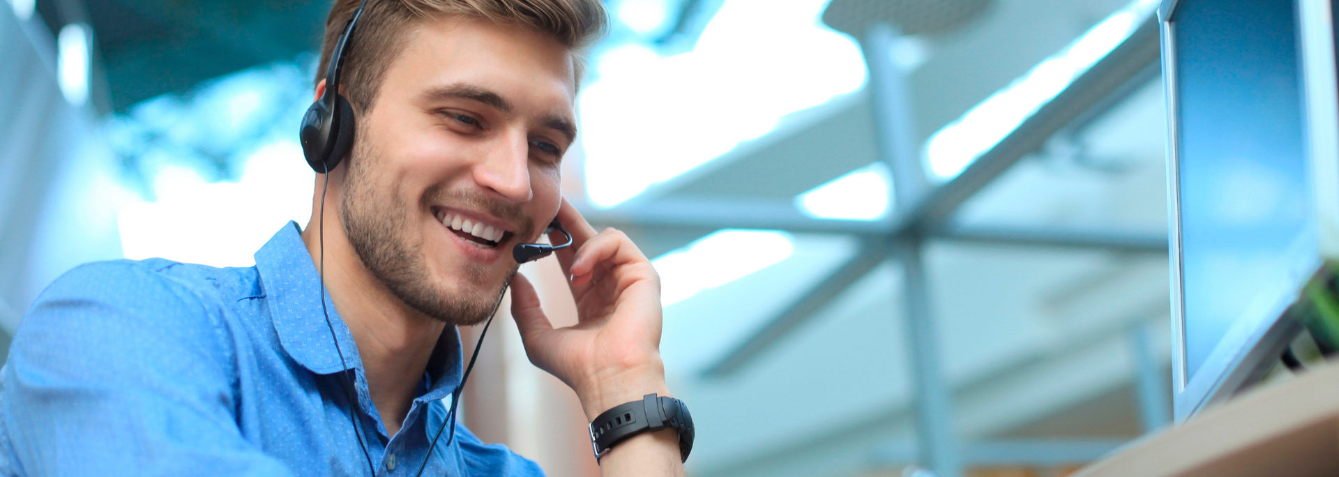 Picture of a customer service worker answering questions on the phone.