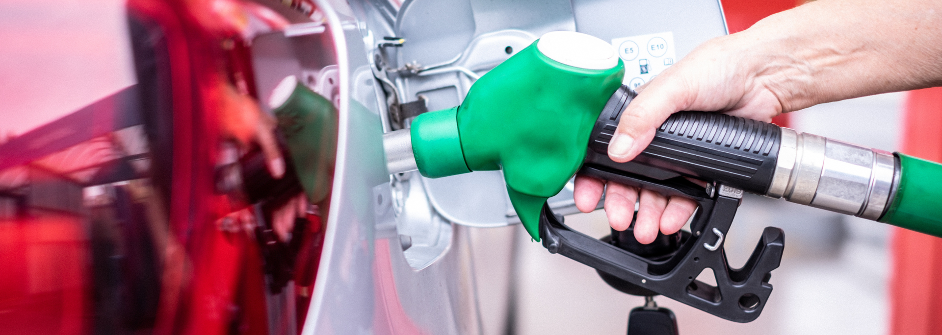 Picture of someone filling up their car with fuel. Picture of someone filling up their car with fuel.
